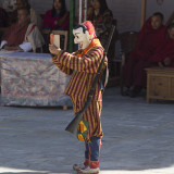 A performer in costume with a mobile phone