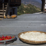 Chillies, Patotoes and oranges drying on the roof