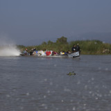 A long boat fully loaded