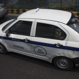 A taxi that been to close in the traffic.