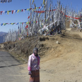 Julie with all the Prayer Flags at the pass